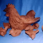 A Chicken and Hens in Clay